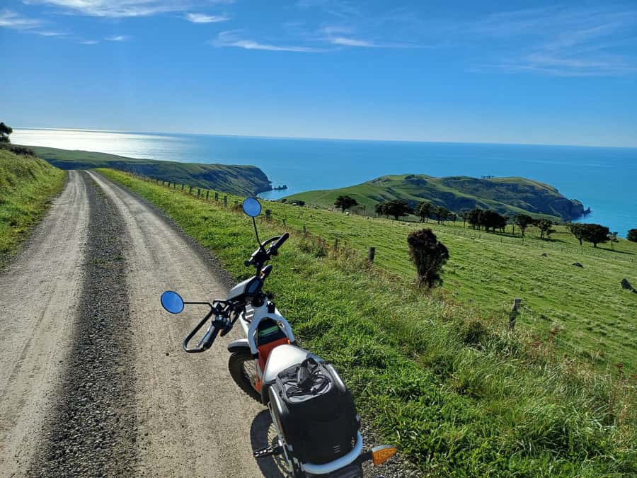 Akaroa: Lonely Beach Trail by E-Scooter. selfguided day out - Three beaches along the route, swim breaks that feel earned