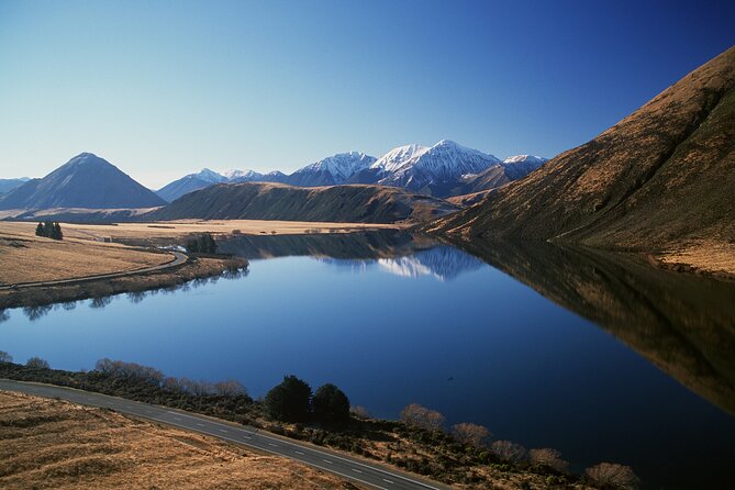 Arthur's Pass Discovery and TranzAlpine Train - Small Group Tour - Cave Stream: limestone cliffs, an underground burrow, and film-location trivia