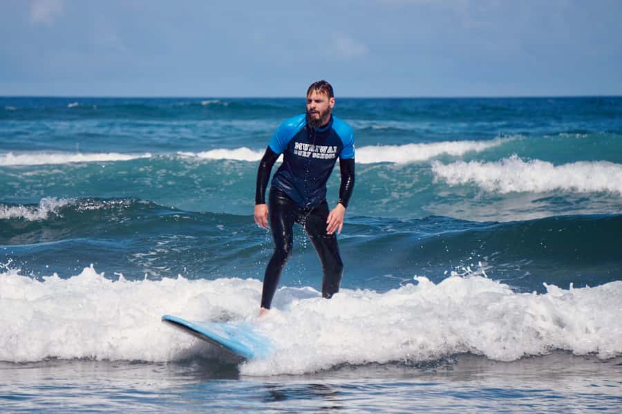 Auckland: Group Surfing Lesson with Muriwai Surf School - What you get for $41 and why the math works