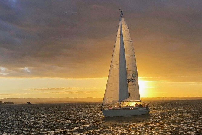 Auckland Harbour Sailboat Cruise Including Three Course Dinner - Waitemata Harbour at sunset: Sky Tower, Harbour Bridge, and the Auckland skyline