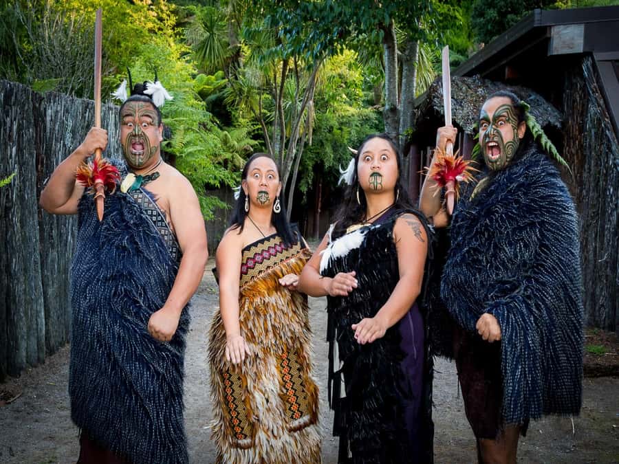 Auckland: Rotorua Tour with Mitai Māori Village & Wai-O-Tapu - The warrior canoe display on Wai-o-Whiro stream