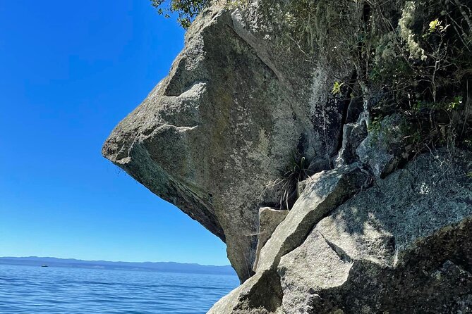Chasing Waterfalls The Adventurer from Kinloch Marina - Stop 1: Western Bay rock faces and the remote feel from minute one