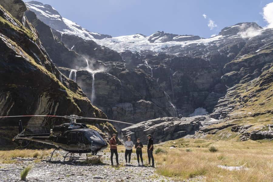 Earnslaw Burn Glacier & Waterfalls | 75min from Queenstown - Earnslaw Burn basin touchdown: hanging glacier, waterfall wall, and close-up scale