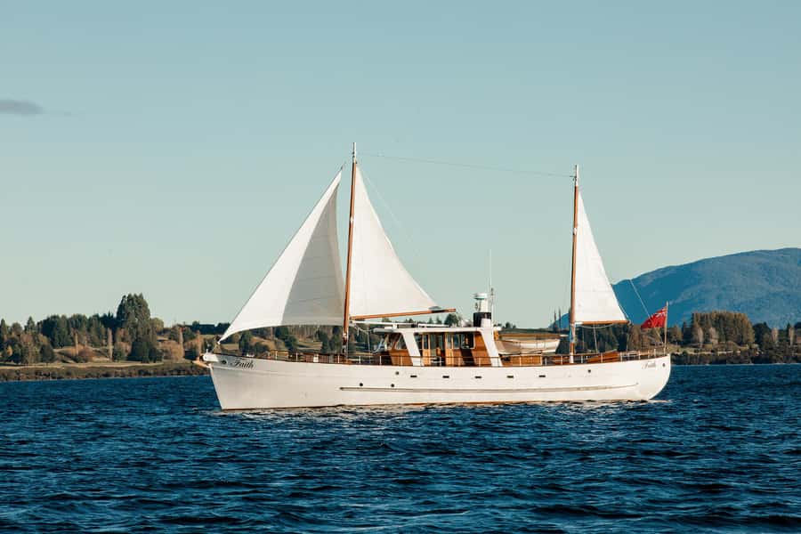 Evening Champagne Cruise on Historic 1935 Motor Yacht. - Getting onboard Faith in Te Anau’s evening light