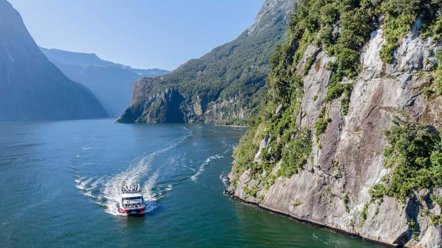 From Queenstown: Coach, Farm Tour & Milford Nature Cruise - From Queenstown to Te Anau, riding the glass-roof coach