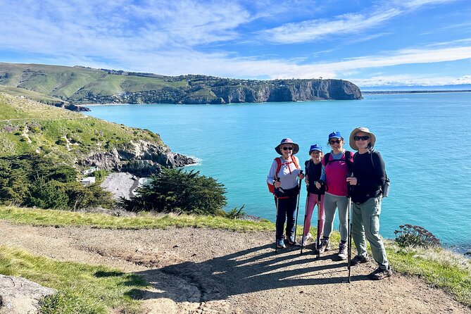 Full Day Guided Walking Tour and Picnic around Godley Head - Stop 2, Taylors Mistake: black sand, then your hike kit gets handed over