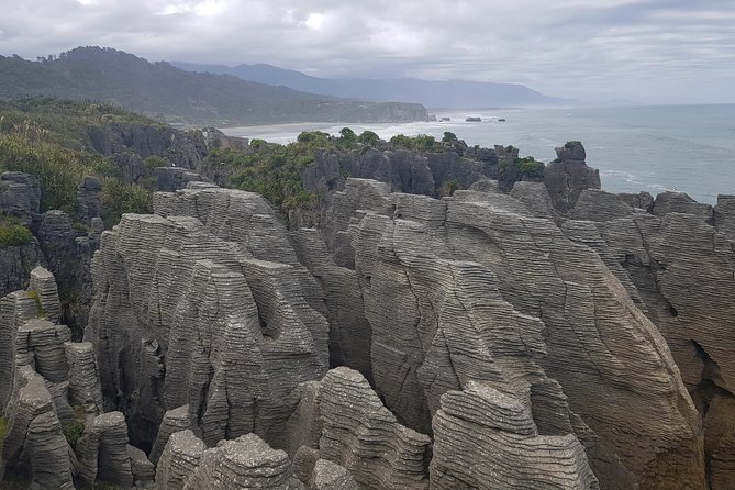 Punakaiki Blow Holes & Pancake Rocks Scenic Tour - Pancake Rocks: stacked limestone and the story under your feet