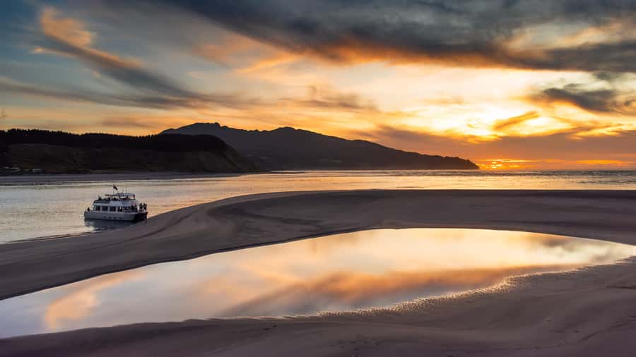 Raglan: Scenic Harbour Sunset Cruise - The pancake rocks: limestone, time, and seeing it with context