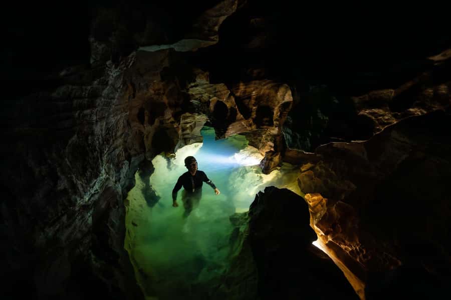The Waitomo Experience : Okohua Glowworm Cave Tour - Wading pools, caverns, and limestone formations
