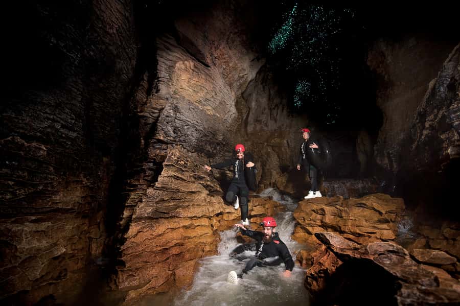 Waitomo Caves Black Abyss Ultimate Caving Experience - Waterfall climbing and canyon navigation (yes, you get splashed)