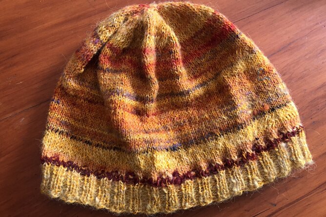 Wool Sheep Farm Experience with Handmade Wool Hat in New Zealand - Rainy Day Planning Without Stress